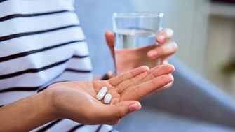 Patient prepares to take pain medication