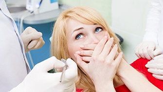 Woman afraid at the dentist